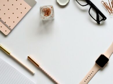 Rose Gold Apple Watch With Pink Sport Band Near Eyeglasses